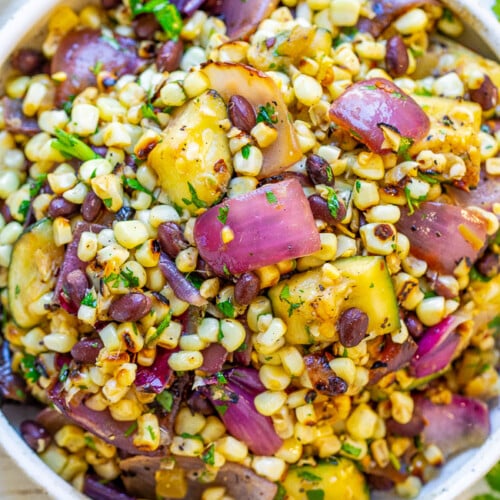 Grilled Corn and Black Bean Salad with red onion in a bowl.