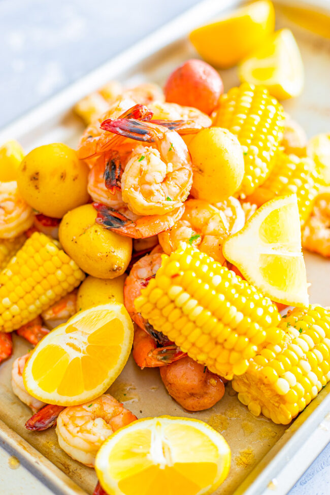 Shrimp Boil - Juicy and succulent large shrimp along with corn and potatoes, all drenched in the most heavenly horseradish butter!! There's the option to make your own homemade and ultra flavorful stock for the boil or use store bought stock as a shortcut! Either way, this is a finger lickin' amazing meal!!
