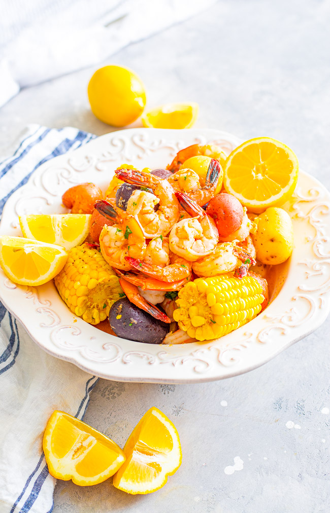 Shrimp Boil - Juicy and succulent large shrimp along with corn and potatoes, all drenched in the most heavenly horseradish butter!! There's the option to make your own homemade and ultra flavorful stock for the boil or use store bought stock as a shortcut! Either way, this is a finger lickin' amazing meal!!