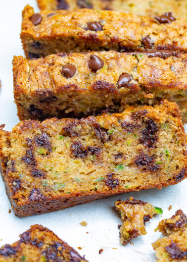 The Best Zucchini Bread - Super moist, tender, loaded with chocolate chips, and so EASY to make!! One bowl, no mixer, and THE BEST zucchini bread you'll ever try!!