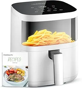 White air fryer with digital display, filled with fries. Includes a recipe booklet featuring a dish of grilled meat and vegetables on the cover.