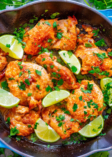 Skillet Lime Cilantro Chicken - EASY, juicy, tender chicken thighs with plenty of tangy lime and fresh cilantro!! Ready in 30 minutes, starts on the stove, and finishes in the oven! Just a handful of ingredients used and PERFECT for busy weeknights!! 