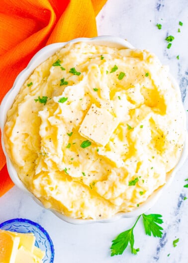 The Best Classic Mashed Potatoes - Buttery, creamy, PERFECT mashed potatoes that rival your favorite restaurant's version but EASY and ready in 45 minutes!! The quintessential holiday side dish for Thanksgiving, Christmas, or a great family-friendly weeknight comfort food side dish!!