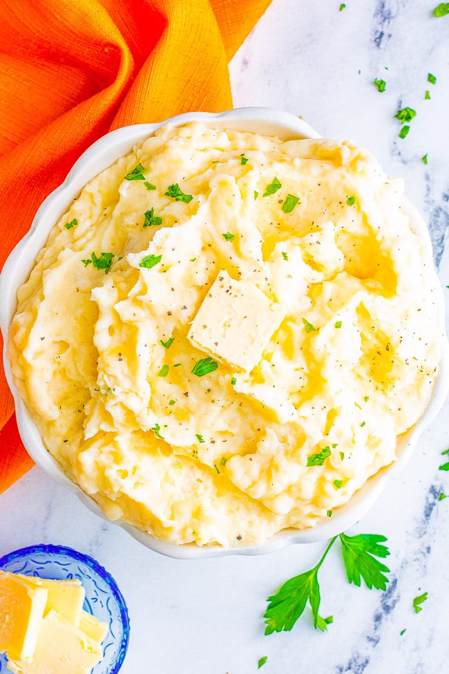 The Best Classic Mashed Potatoes - Buttery, creamy, PERFECT mashed potatoes that rival your favorite restaurant's version but EASY and ready in 45 minutes!! The quintessential holiday side dish for Thanksgiving, Christmas, or a great family-friendly weeknight comfort food side dish!!