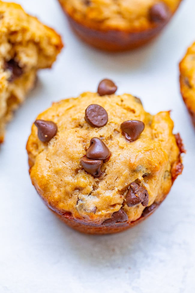 Peanut Butter Banana Chocolate Chip Muffins - Loaded with rich peanut butter and banana flavor and studded with chocolate in every bite!! This FAST and EASY muffin recipe is one bowl, no mixer, and perfect for those ripe bananas you have!!
