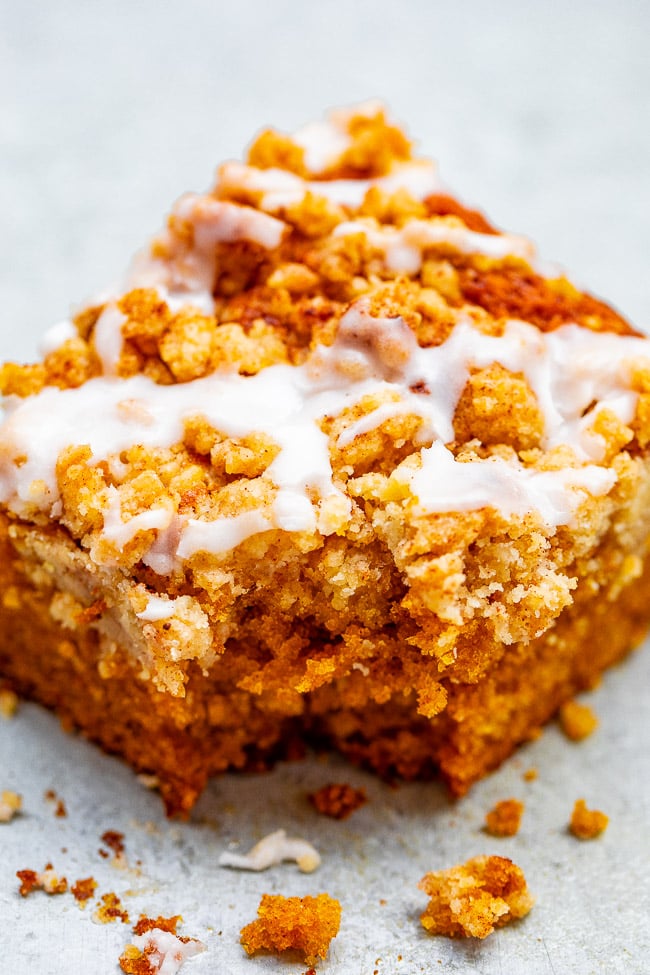 Glazed Pumpkin Coffee Cake - A FAST and EASY no-mixer pumpkin coffee cake with rich pumpkin flavor and topped with big buttery crumbles!! So soft, moist, tender! You're going to LOVE this cake for breakfast, brunch, or entertaining!!