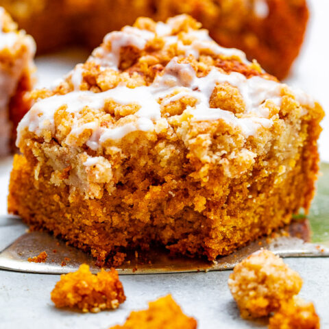Glazed Pumpkin Coffee Cake - A FAST and EASY no-mixer pumpkin coffee cake with rich pumpkin flavor and topped with big oatmeal crumbles!! So soft, moist, tender! You're going to LOVE this cake for breakfast, brunch, or entertaining!!