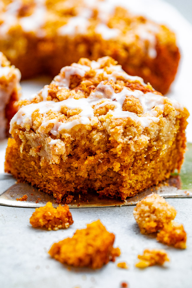Glazed Pumpkin Coffee Cake - A FAST and EASY no-mixer pumpkin coffee cake with rich pumpkin flavor and topped with big oatmeal crumbles!! So soft, moist, tender! You're going to LOVE this cake for breakfast, brunch, or entertaining!!