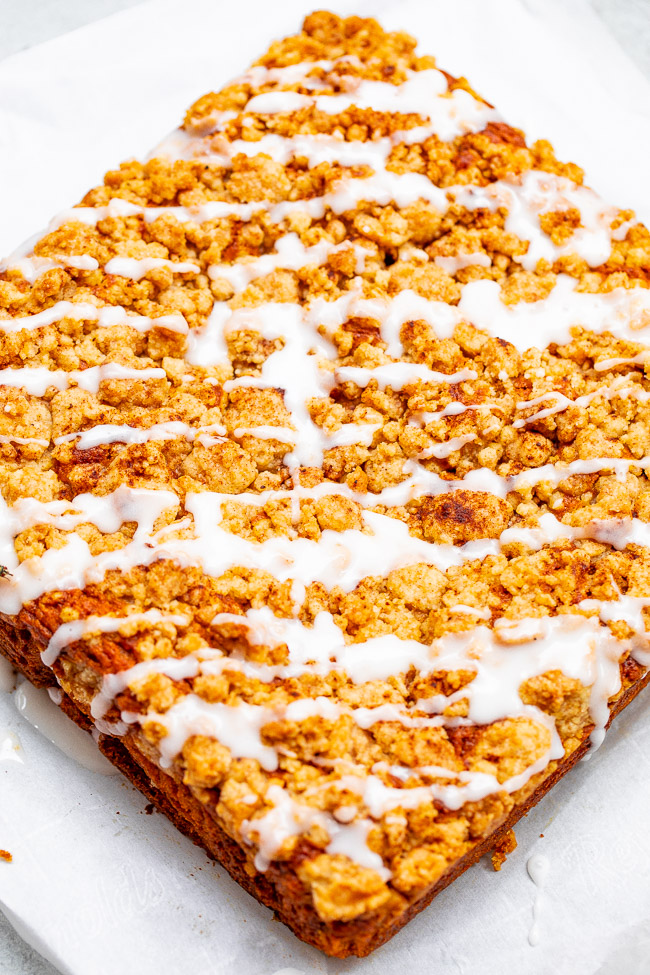 Glazed Pumpkin Coffee Cake - A FAST and EASY no-mixer pumpkin coffee cake with rich pumpkin flavor and topped with big buttery crumbles!! So soft, moist, tender! You're going to LOVE this cake for breakfast, brunch, or entertaining!!