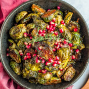 Balsamic Glazed Brussels Sprouts with Pomegranate Seeds - An easy side dish that's perfect for not only the holidays but anytime you're in the mood for CRISPY roasted Brussels sprouts!! The homemade balsamic glaze seeps into every inch of the spouts and adds so much tangy-sweet flavor!! 