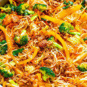 Asian Pork Noodle Stir Fry - An EASY comfort food stir fry that's ready in 20 minutes with so many textures and flavors in every bite!! Juicy pork, tender noodles, crisp-tender veggies in a bath of sesame oil, soy sauce, ginger, and chili garlic sauce if you want to turn up the heat!! 