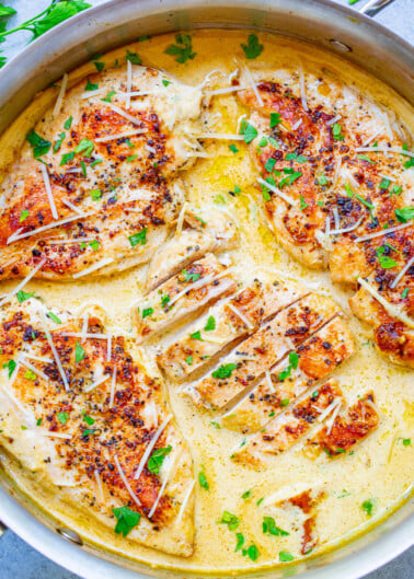Creamy Parmesan Dijon Skillet Chicken - Tender, juicy chicken bathed in a divine cream sauce made with garlic, cream, Dijon mustard, and a splash of wine for extra flavor!! This restaurant-quality EASY stovetop chicken is ready in 20 minutes and will be a family FAVORITE! 
