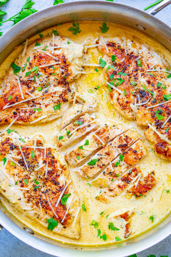 Creamy Parmesan Dijon Skillet Chicken - Tender, juicy chicken bathed in a divine cream sauce made with garlic, cream, Dijon mustard, and a splash of wine for extra flavor!! This restaurant-quality EASY stovetop chicken is ready in 20 minutes and will be a family FAVORITE! 