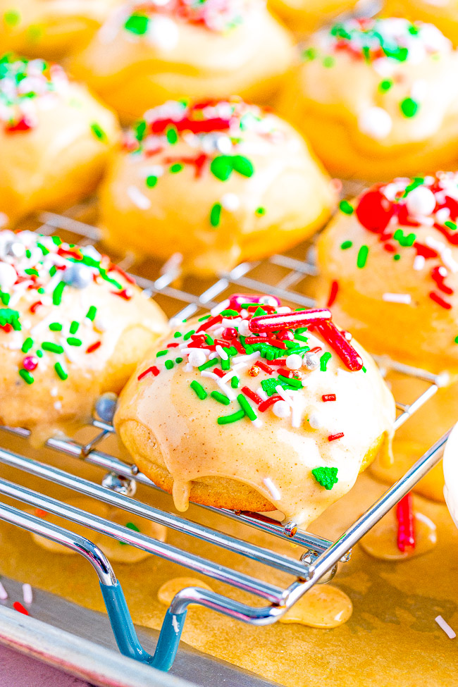 Eggnog Cookies — Soft, buttery tea cakes topped with a creamy eggnog glaze are a Christmas treat that everyone will love!! EASY to make, not at all dry, and great for cookie exchanges or hostess gifts!!
