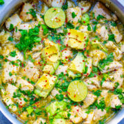 15-Minute Salsa Verde Chicken with Avocado in a skillet topped with cilantro and lime.