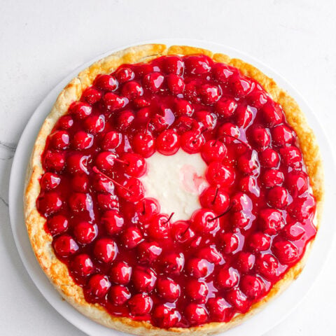 Cherry Cream Pie - An old-fashioned pie with homemade scratch crust topped with NO-BAKE layers of sweetened cream cheese along with juicy cherry pie filling!! If you like cherry pie, you're going to LOVE this amped up version!!
