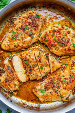 A skillet of garlic butter chicken breasts.