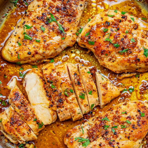 Garlic Butter Chicken - Tender, juicy chicken bathed in a rich garlic butter sauce with a splash of wine for extra flavor!! This EASY stovetop chicken recipe is ready in 15 minutes and will become a family FAVORITE!!