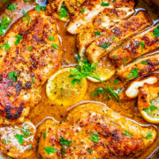 Lemon Butter Dijon Skillet Chicken - Tender, juicy chicken with a scrumptious sauce made with lemon butter, Dijon mustard, and a splash of wine for extra flavor!! This EASY stovetop chicken recipe is ready in 15 minutes and will become a family dinner FAVORITE!!