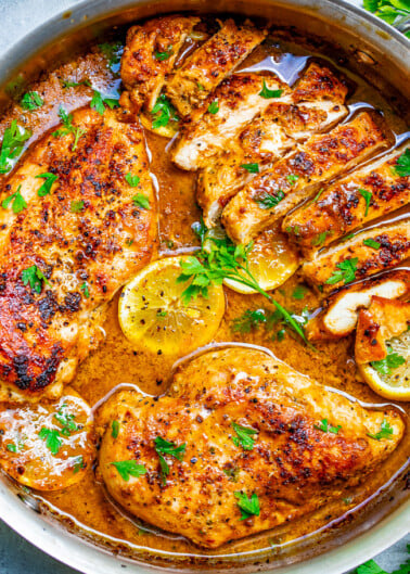 Lemon Butter Dijon Skillet Chicken - Tender, juicy chicken with a scrumptious sauce made with lemon butter, Dijon mustard, and a splash of wine for extra flavor!! This EASY stovetop chicken recipe is ready in 15 minutes and will become a family dinner FAVORITE!!