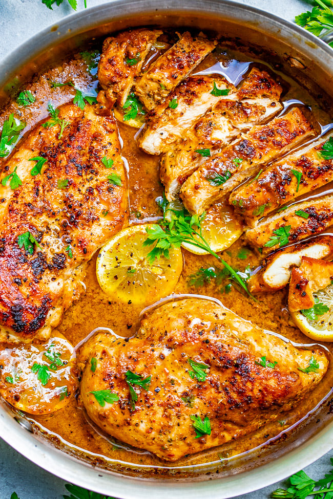 Lemon Butter Dijon Skillet Chicken - Tender, juicy chicken with a scrumptious sauce made with lemon butter, Dijon mustard, and a splash of wine for extra flavor!! This EASY stovetop chicken recipe is ready in 15 minutes and will become a family dinner FAVORITE!! - Creamy Tuscan Chicken