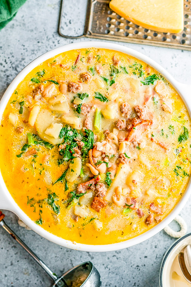 Loaded Zuppa Toscana Soup — This COPYCAT version of the Olive Garden classic can be made either on the STOVETOP, INSTANT POT, or SLOW COOKER!! A comforting classic Tuscan kale soup that's loaded with bacon, sausage, potatoes, Parmesan, cream, and more!!