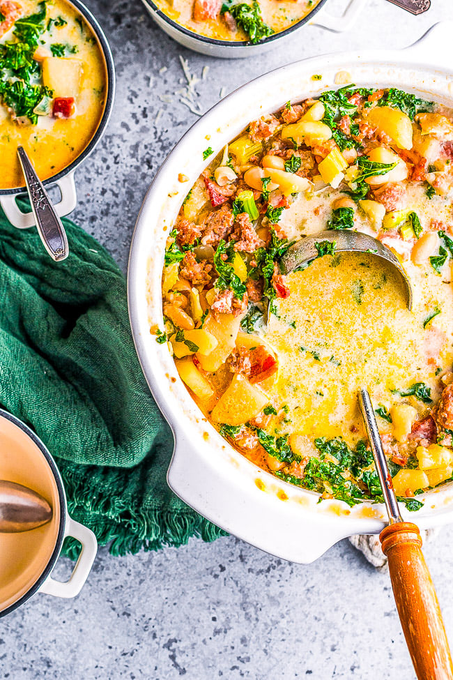 Loaded Zuppa Toscana Soup — This COPYCAT version of the Olive Garden classic can be made either on the STOVETOP, INSTANT POT, or SLOW COOKER!! A comforting classic Tuscan kale soup that's loaded with bacon, sausage, potatoes, Parmesan, cream, and more!!