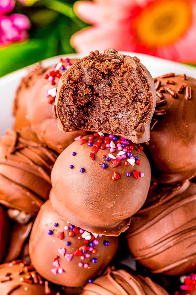 Fudgy Brownie Balls — Looking for things to make with brownie mix? Look no further! These brownie balls are made with brownies, chocolate frosting, and dipped in melted chocolate! The combination of all that rich chocolate is absolutely PERFECT! 
