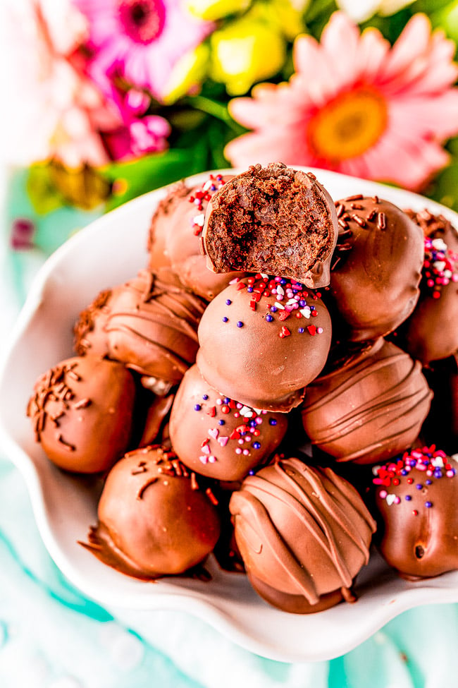 Fudgy Brownie Balls — Looking for things to make with brownie mix? Look no further! These brownie balls are made with brownies, chocolate frosting, and dipped in melted chocolate! The combination of all that rich chocolate is absolutely PERFECT! 