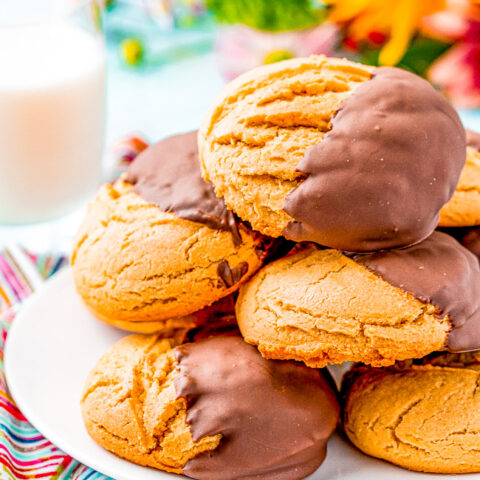 Peanut Butter Pudding Cookies - These chocolate-dipped peanut butter pudding cookies are SOFT AND CHEWY on the inside thanks to the addition of pudding mix in the cookie dough! Dipping them in dark chocolate makes for the PERFECT flavor combo!!