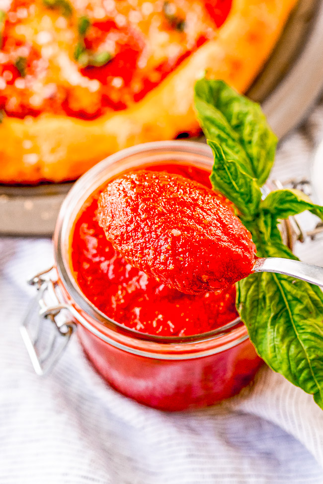Easy Pizza Sauce Recipe — A no-cook, no-blender recipe for homemade pizza sauce that's ready in five minutes!! Simply whisk the ingredients together and get ready to enjoy pizza sauce that's BURSTING with flavor! Once you see how EASY this is, you'll never need the store bought kind again!!