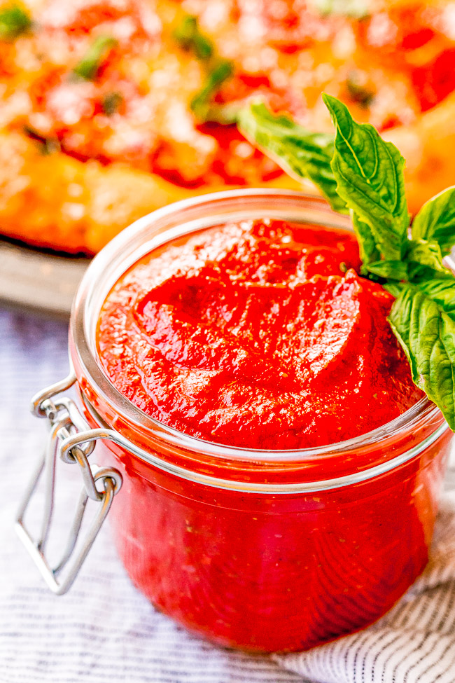 Homemade Pizza Sauce - A no-cook, no-blender recipe for homemade pizza sauce that's ready in five minutes!! Simply whisk the ingredients together and get ready to enjoy pizza sauce that's BURSTING with flavor! Once you see how EASY this is, you'll never need the store bought kind again!!