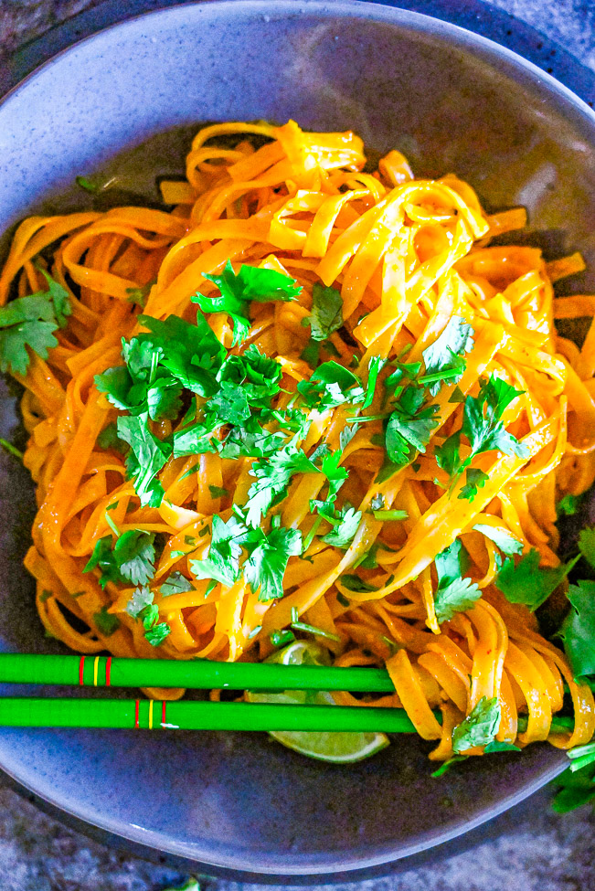 Instant Pot Thai Curry Noodles - Make these EASY Thai-inspired curry noodles in either your Instant Pot OR on the stovetop!! Either way these noodles are COMFORTING, flavorful, and ready in less than 10 MINUTES! Faster than calling for takeout!!