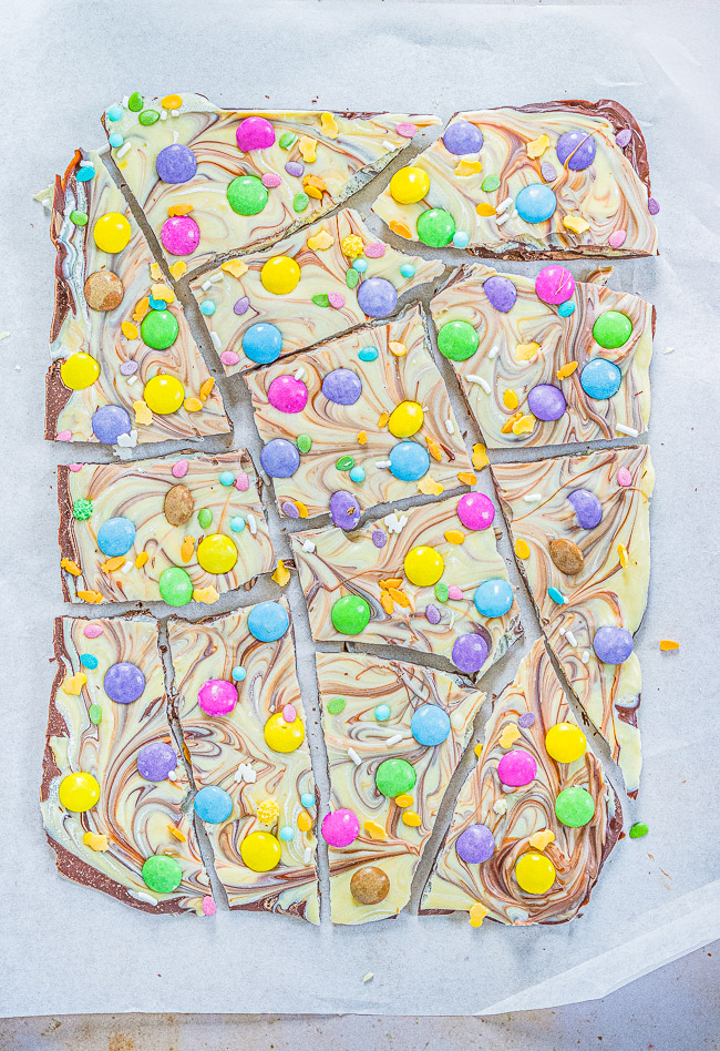 Easter Bark — A mixture of milk and white chocolate swirled together and topped with M&Ms and sprinkles!! Such a FAST, EASY, NO-BAKE, and MAKE-AHEAD treat that's perfect for Easter, springtime, or Mother's Day!!