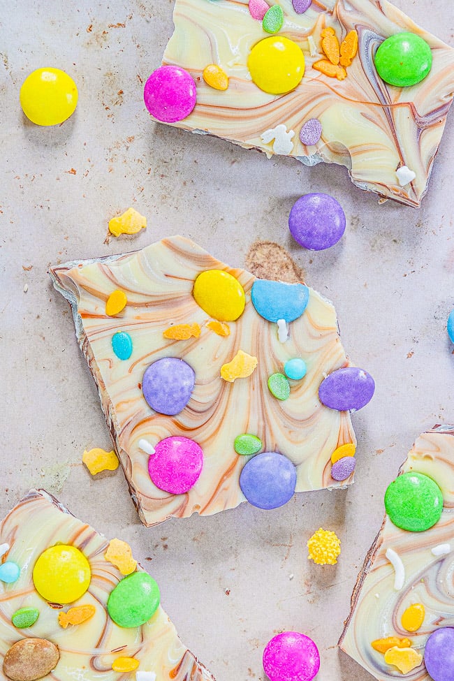 Easter Bark — A mixture of milk and white chocolate swirled together and topped with M&Ms and sprinkles!! Such a FAST, EASY, NO-BAKE, and MAKE-AHEAD treat that's perfect for Easter, springtime, or Mother's Day!!
