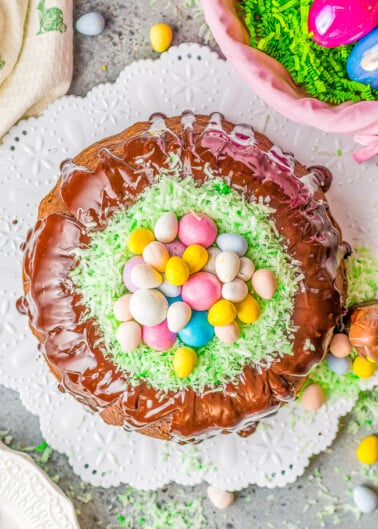 Easter Egg Treasure Cake – This FUN cake is made with two different cake mixes. The eggs, chicks, and bunnies from the first cake are cut out and put in the second cake before it’s baked. Decorated with coconut grass and candy eggs, this is a FESTIVE Easter dessert with buried TREASURES inside!! Use the leftover cake to cut out more mini cakes and let the kids decorate for extra fun!