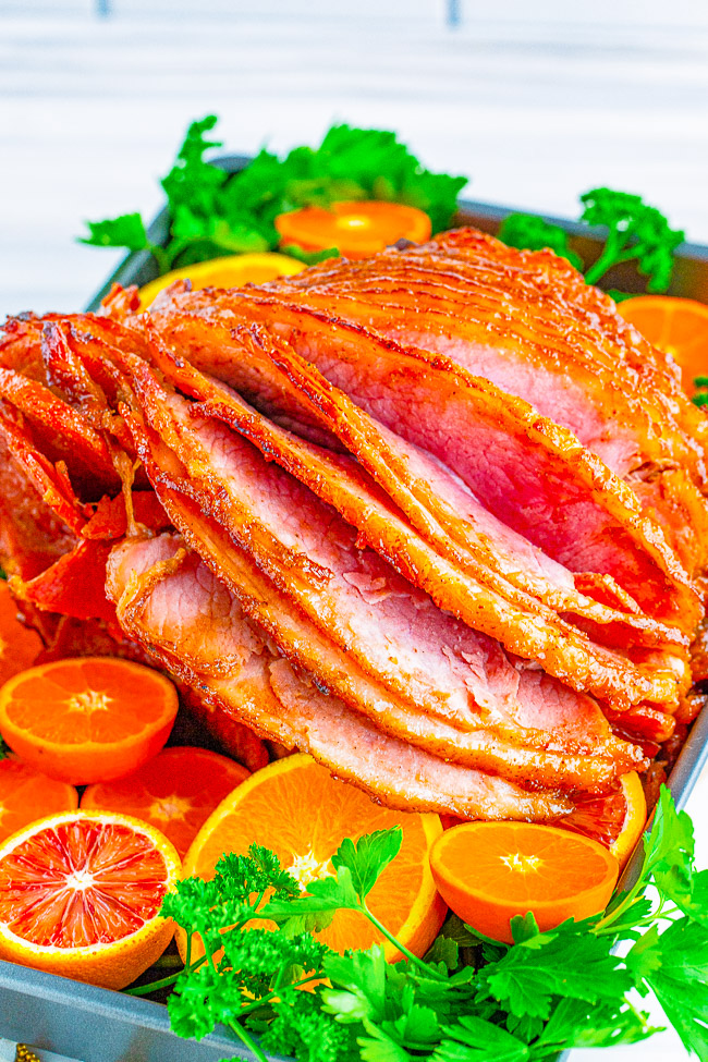 Honey Baked Ham - Spiral baked honey ham that's SO EASY you really can't mess it up! The sweetness from the honey works perfectly with the saltiness of the ham. This ham is similar to the honey baked ham everyone loves to purchase but so much less expensive! Perfect for HOLIDAY MEALS and family dinners!