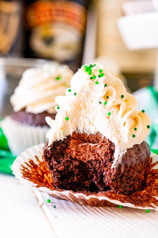 Irish Chocolate Cupcakes - A tender chocolate cupcake made from scratch with batter that's spiked with Guinness, along with a hint of Jameson Irish whiskey in the chocolate ganache filling, and frosted with a silky smooth Baileys buttercream frosting!! Not too boozy and not too sweet! Makes a smaller batch of 12 and PERFECT for St. Patrick’s Day!!