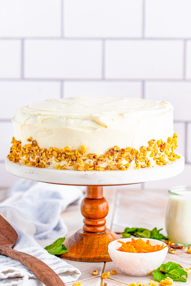 Spiced Carrot Cake with Cream Cheese Frosting — A tender and moist classic two-layer carrot cake with tangy-sweet cream cheese frosting! For anyone who loves carrot cake, this cake looks and tastes so impressive but is EASY to make!
