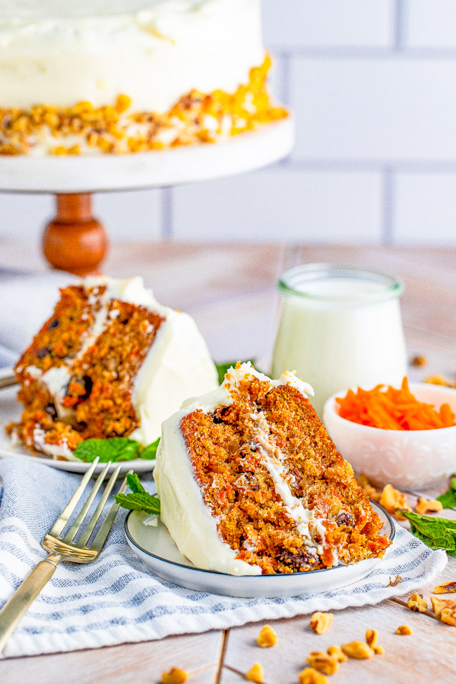 Layered Carrot Cake with Cream Cheese Frosting - A tender and moist classic two-layer carrot cake with tangy-sweet cream cheese frosting! For anyone who loves carrot cake, this cake looks and tastes so impressive but is EASY to make! Perfect for Easter, springtime, or any carrot cake cravings you have!