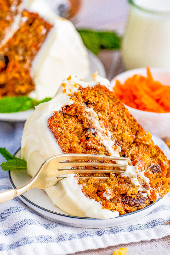 Layered Carrot Cake with Cream Cheese Frosting - A tender and moist classic two-layer carrot cake with tangy-sweet cream cheese frosting! For anyone who loves carrot cake, this cake looks and tastes so impressive but is EASY to make! Perfect for Easter, springtime, or any carrot cake cravings you have!
