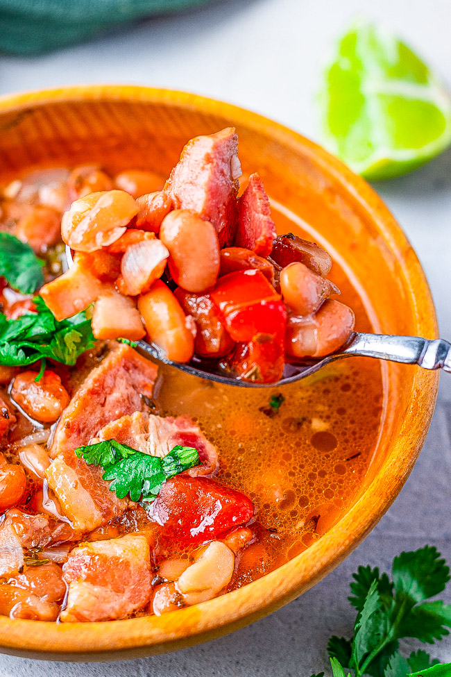Borracho Beans - These “drunken beans” are simmered with a can of BEER and can be made in your SLOW COOKER OR INSTANT POT! The bacon, sausage or chorizo, jalepenos, tomato, onion, garlic, herbs, and beer make these the BEST beans ever! A wonderful side for any Mexican-themed meal!