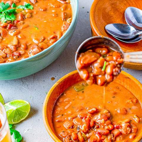 Borracho Beans - These “drunken beans” are simmered with a can of BEER and can be made in your SLOW COOKER OR INSTANT POT! The bacon, sausage or chorizo, jalepenos, tomato, onion, garlic, herbs, and beer make these the BEST beans ever! A wonderful side for any Mexican-themed meal!