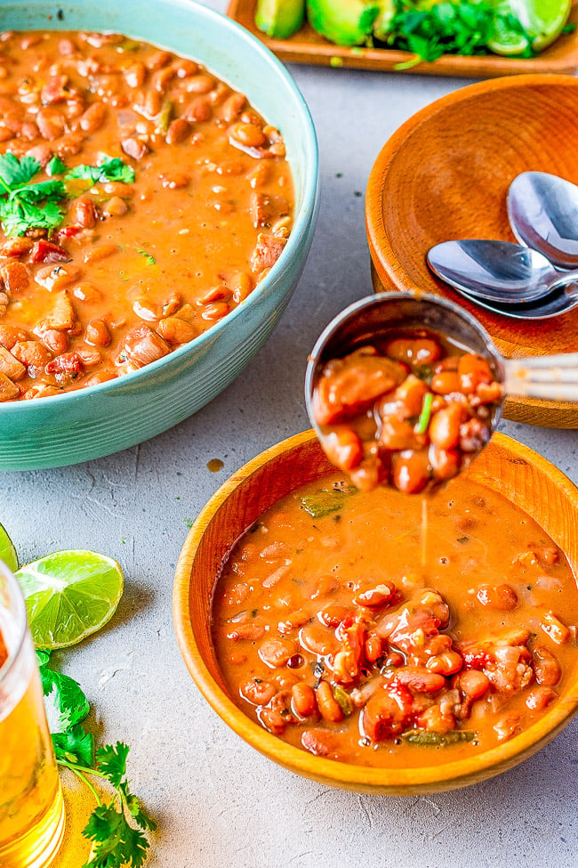 Borracho Beans - These “drunken beans” are simmered with a can of BEER and can be made in your SLOW COOKER OR INSTANT POT! The bacon, sausage or chorizo, jalepenos, tomato, onion, garlic, herbs, and beer make these the BEST beans ever! A wonderful side for any Mexican-themed meal! - Instant Pot Black Beans