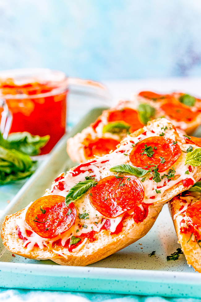 French Bread Pizza - This FAST and EASY pizza recipe incorporates a French bread crust. This handy shortcut saves you time on busy weeknights to make home-baked pizza a reality. Pizza is always a family FAVORITE and this thick and chewy variety will be a big hit!