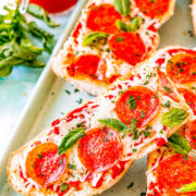 French Bread Pizza - This FAST and EASY pizza recipe incorporates a French bread crust. This handy shortcut saves you time on busy weeknights to make home-baked pizza a reality. Pizza is always a family FAVORITE and this thick and chewy variety will be a big hit!