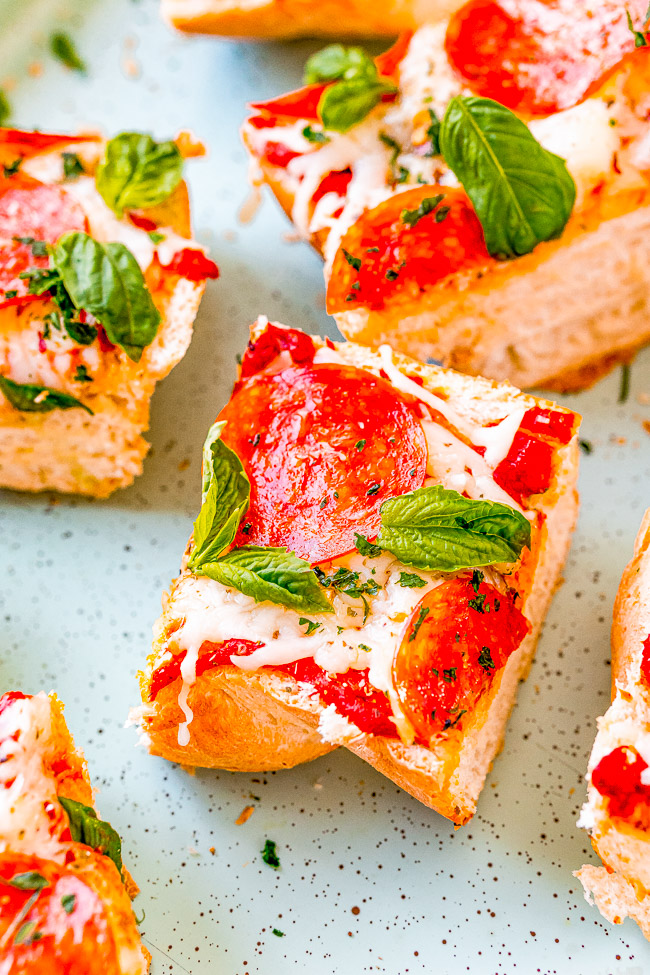 Homemade French Bread Pizza — This FAST and EASY pizza recipe incorporates a French bread crust. This handy shortcut saves you time on busy weeknights to make home-baked pizza a reality. Pizza is always a family FAVORITE and this thick and chewy variety will be a big hit!