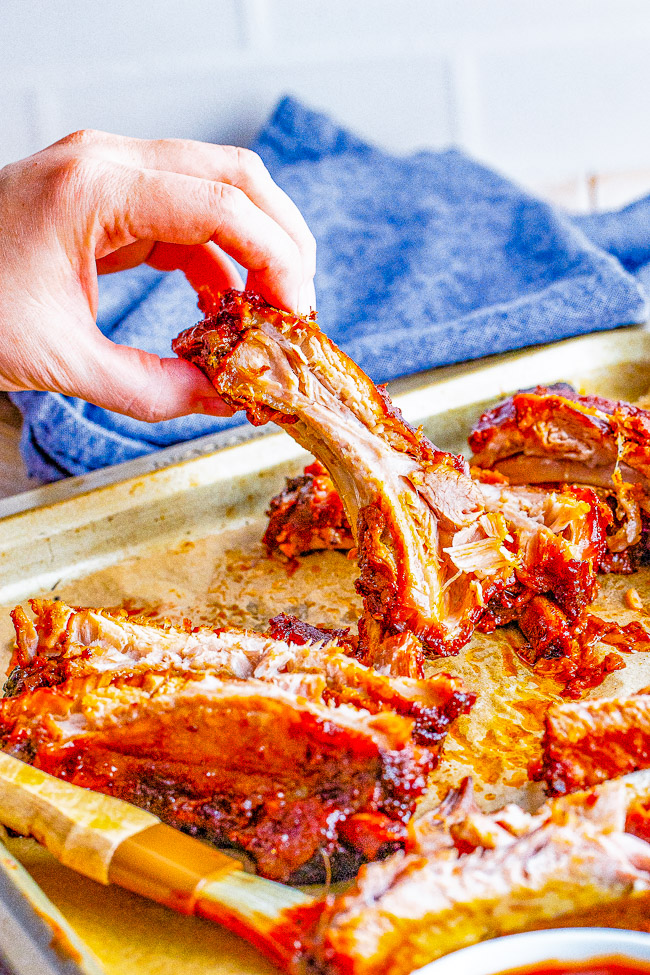 Slow Cooker Ribs - Tender, juicy, fall-off-the-bone baby back pork ribs that are finger-lickin' good! With just 5 minutes of active prep, your slow cooker does all the work in creating ribs that your friends and family will beg you to make over and over! 