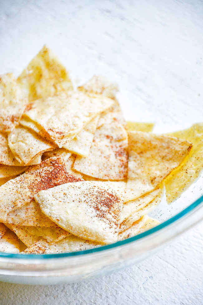 Baked Corn Tortilla Chips — Making tortilla chips at home is FAST and EASY! Ready in just 20 minutes. These are BAKED not fried so they're healthier, too! Perfect for salsa, guac, or anytime you need tortilla chips!