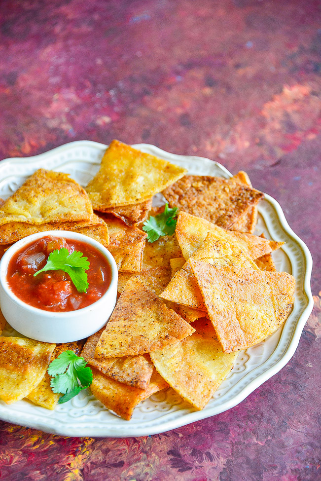 Baked Corn Tortilla Chips — Making tortilla chips at home is FAST and EASY! Ready in just 20 minutes. These are BAKED not fried so they're healthier, too! Perfect for salsa, guac, or anytime you need tortilla chips!